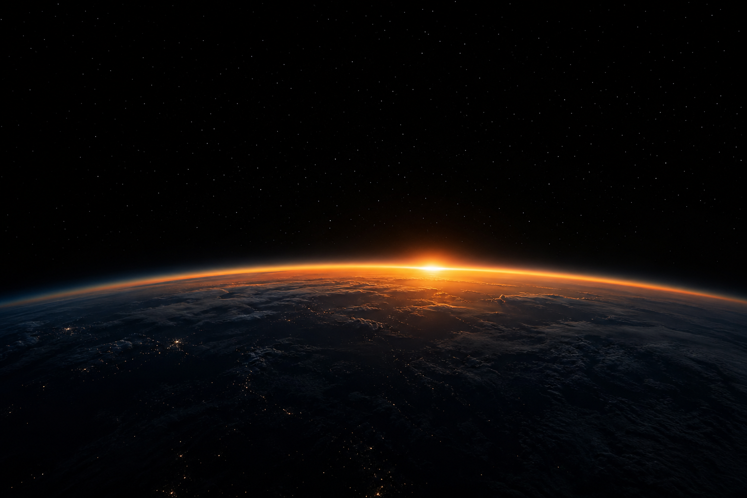Earth's horizon at sunrise from orbit against dark space